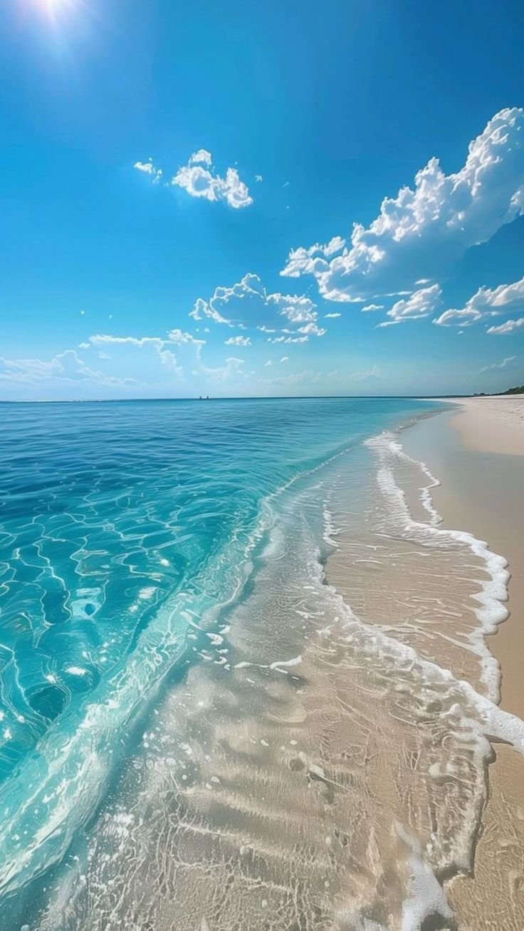 Sunlit Shore with Blue Waves Download Wallpapers